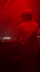 Nightclub event with DJ and costumed patrons in Tel Aviv