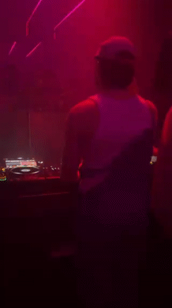 Nightclub event with DJ and costumed patrons in Tel Aviv