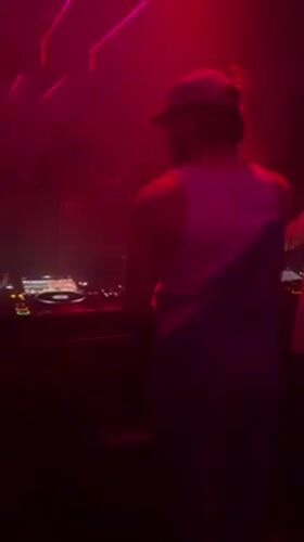 Nightclub event with DJ and costumed patrons in Tel Aviv