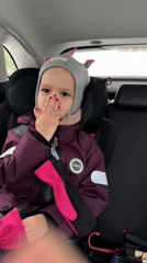 Child in winter car ride captured in snowy Chaikovsky