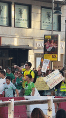Green-shirted protesters march through Valencia streets with drums