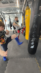 Boy practices martial arts in Perm gymnasium