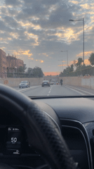 Evening drive captured through palm-lined streets of Marrakesh