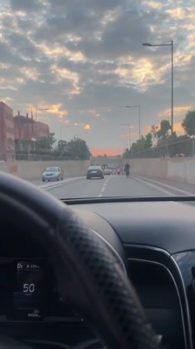 Evening drive captured through palm-lined streets of Marrakesh