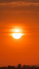 Orange sunset documented over León, Mexico residential area