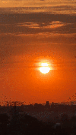 Orange sunset documented over León, Mexico residential area