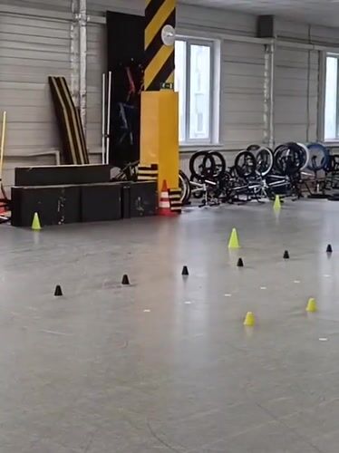 Children practice roller skating indoors in Novosibirsk sports facility