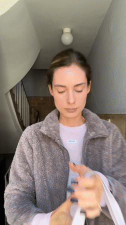 Woman takes selfie in Kiel building stairwell