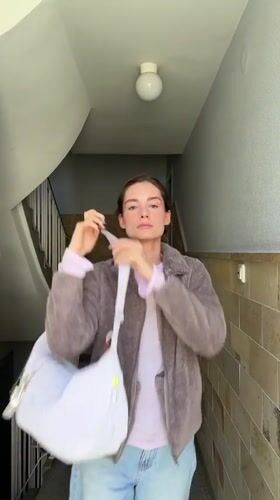 Woman takes selfie in Kiel building stairwell