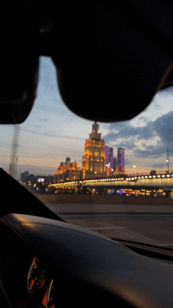 Evening drive captured through illuminated Moscow streets