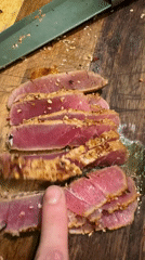 Home chef prepares sesame-crusted seared tuna in Sofia kitchen