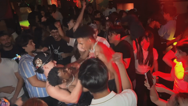 Nightclub scene captured in Liangjiang with DJ and dancing patrons