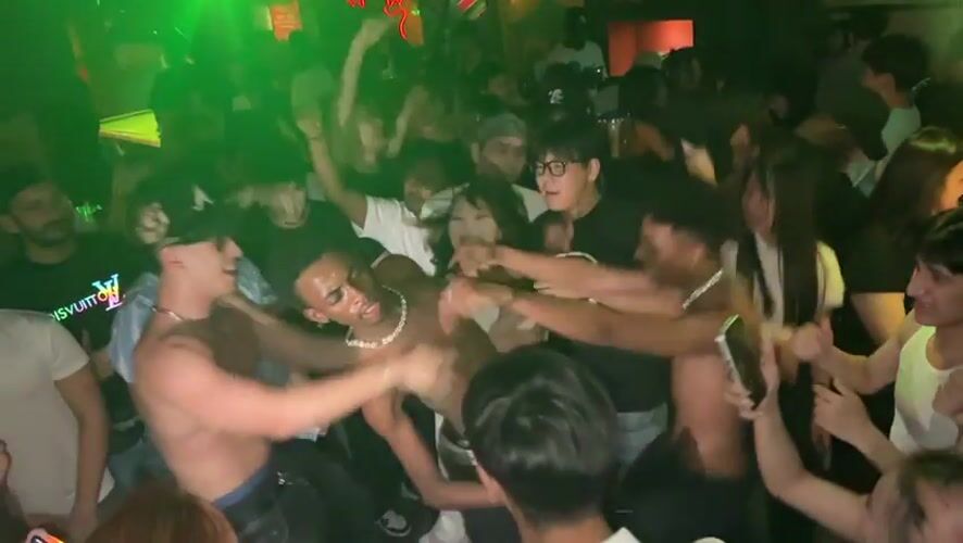 Nightclub scene captured in Liangjiang with DJ and dancing patrons