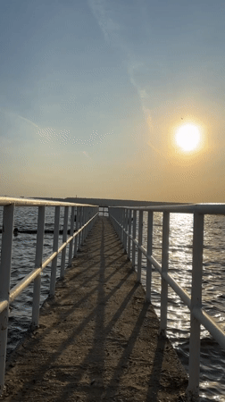 Sunset silhouette captured on Kama River pier in Perm