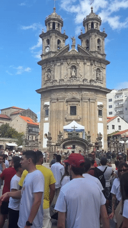 Crowd gathers at baroque church plaza in Pontevedra