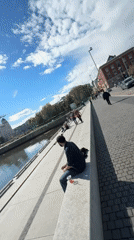 Young man takes selfie on Oslo waterfront walkway
