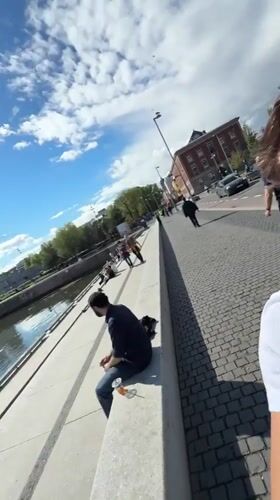 Young man takes selfie on Oslo waterfront walkway
