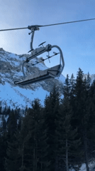 Skier documents chairlift views of groomed slopes in Courchevel