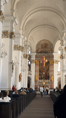 Tourist documents Heidelberg's historic architecture during afternoon walking tour