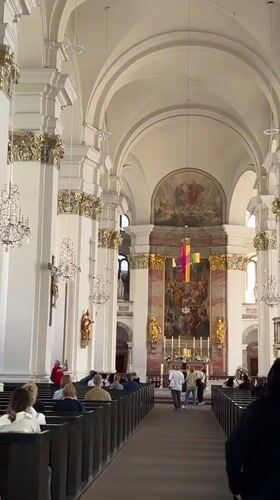Tourist documents Heidelberg's historic architecture during afternoon walking tour