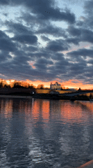 Orange sunset illuminates Volkhov River in Veliky Novgorod