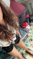 Young woman takes selfies indoors in Kiryat Bialik