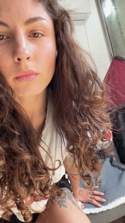 Young woman takes selfies indoors in Kiryat Bialik