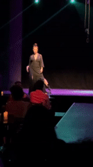 Late-night theatrical performance captured by audiences in Buenos Aires
