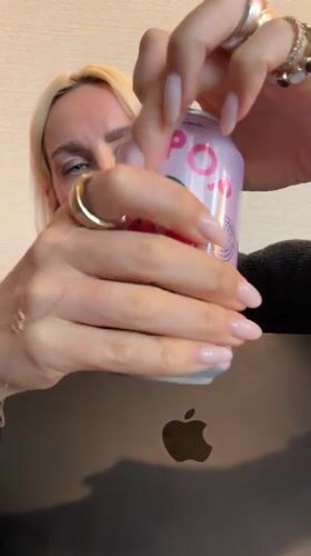Woman and soda can observed indoors in San Diego