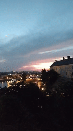 Novi Sad skyline at dusk, Danube reflecting city lights