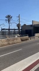 Car passes Vilassar de Mar train station in Spain