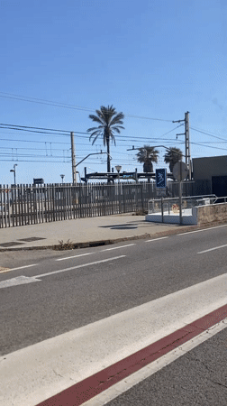 Car passes Vilassar de Mar train station in Spain