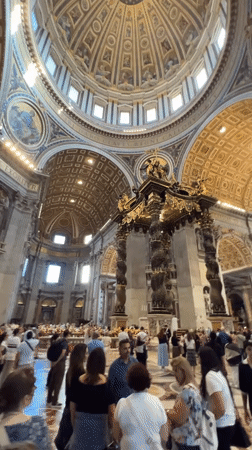 Tourists explore St. Peter's Basilica interior during afternoon visit