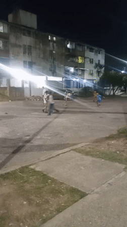 Children play nighttime soccer in Tinaquillo Venezuela streets