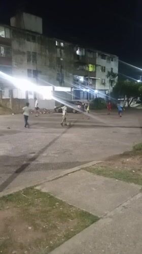 Children play nighttime soccer in Tinaquillo Venezuela streets