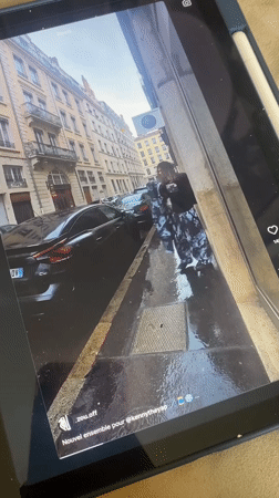 Rainy day street moments and social media viewing in Villeurbanne