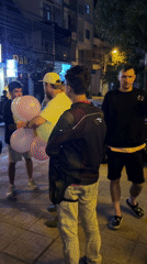 Evening street gathering near restaurant in Vietnam