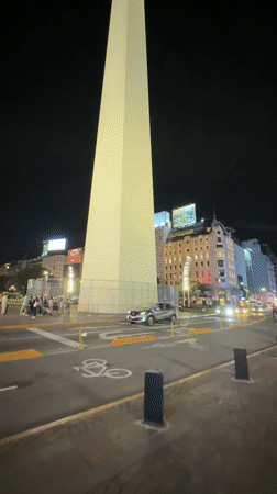 Buenos Aires evening captures pedestrians near Obelisk, indoor crafting