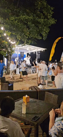 Live band performs beachside concert in Denpasar, Indonesia