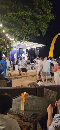 Live band performs beachside concert in Denpasar, Indonesia