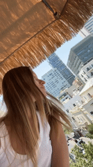 Woman records selfie videos on Tel Aviv street
