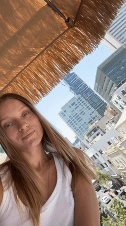 Woman records selfie videos on Tel Aviv street