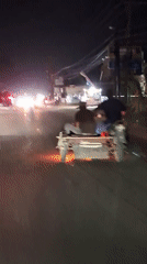 Motorcycle with sidecar carries two passengers in Lhokseumawe