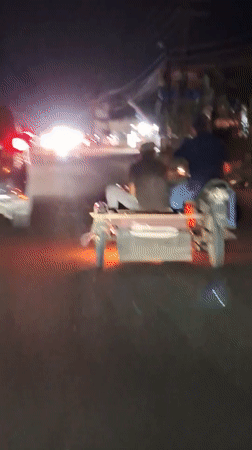 Motorcycle with sidecar carries two passengers in Lhokseumawe