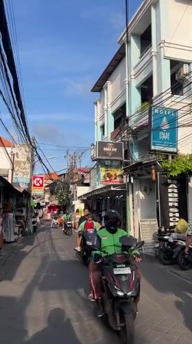 Street life and a beach sunset in Kuta, Bali