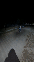 Child rides bicycle on snowy road in Dubovaya