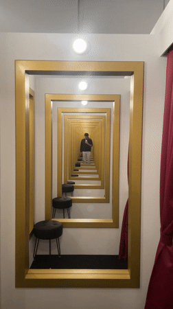 Selfie taken in scratched mirror reflects Barcelona street scene