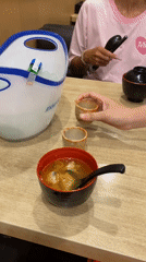 Diners enjoy soju and sushi restaurant meal in Vietnam