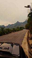 Vehicle traffic recorded on mountain road in rural Vietnam