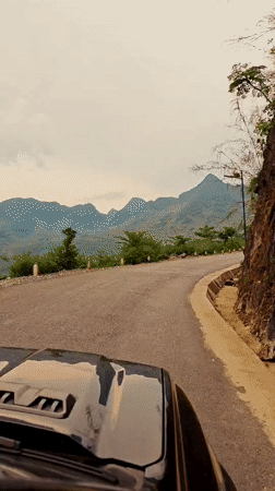 Vehicle traffic recorded on mountain road in rural Vietnam